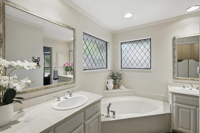 2420 Cross Timbers Trl, Arlington, TX 76006 - full bath featuring two vanities, ornamental molding, a bath, healthy amount of natural light, and recessed lighting