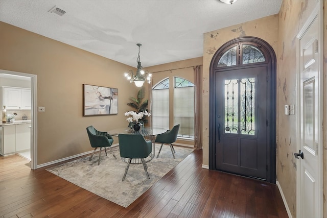 2420 Cross Timbers Trl, Arlington, TX 76006 - entrance foyer featuring a chandelier, dark wood-style flooring, and baseboards