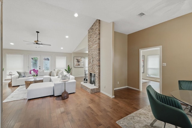 2420 Cross Timbers Trl, Arlington, TX 76006 - living room with ceiling fan, wood finished floors, a fireplace, baseboards, and high vaulted ceiling