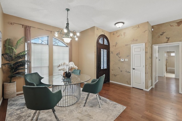 2420 Cross Timbers Trl, Arlington, TX 76006 - dining space featuring a chandelier, baseboards, wood finished floors, wallpapered walls, and plenty of natural light