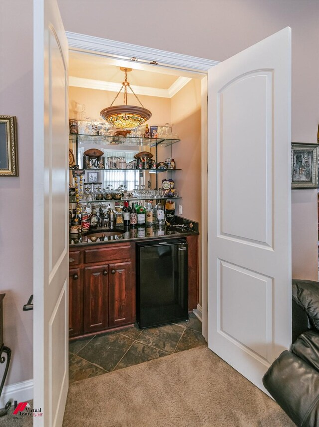 520 Canterbury Ln, Bossier City, LA 71111 - indoor dry bar with ornamental molding, refrigerator, dark carpet, and decorative light fixtures