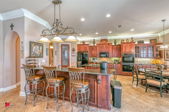 520 Canterbury Ln, Bossier City, LA 71111 - kitchen featuring black appliances, ornamental molding, a spacious island, arched walkways, and backsplash