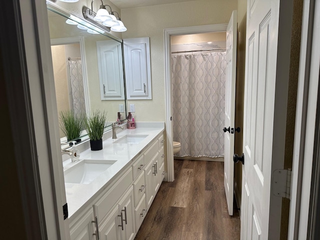 749 Ranch Rd, Fort Worth, TX 76131 - bathroom with wood finished floors, double vanity, and a shower with curtain