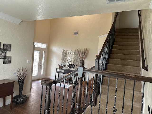749 Ranch Rd, Fort Worth, TX 76131 - entryway featuring a textured wall, wood finished floors, a textured ceiling, and stairs