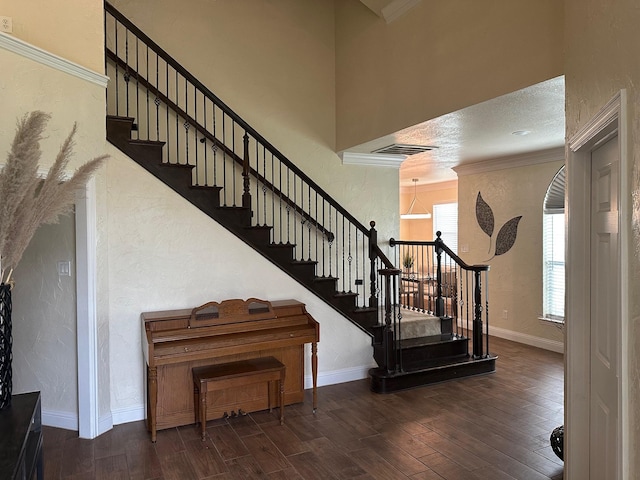 749 Ranch Rd, Fort Worth, TX 76131 - stairs with wood finished floors, crown molding, a textured wall, and a high ceiling