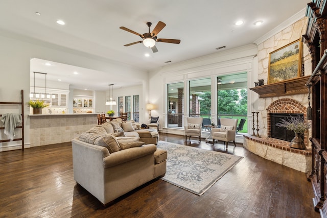 1850 Hammerly Dr, Fairview, TX 75069 - living area featuring a ceiling fan, a fireplace, ornamental molding, dark wood-style flooring, and recessed lighting