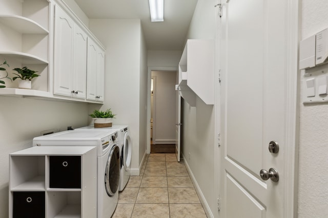 1850 Hammerly Dr, Fairview, TX 75069 - washroom featuring washer and clothes dryer, cabinet space, light tile patterned floors, and baseboards