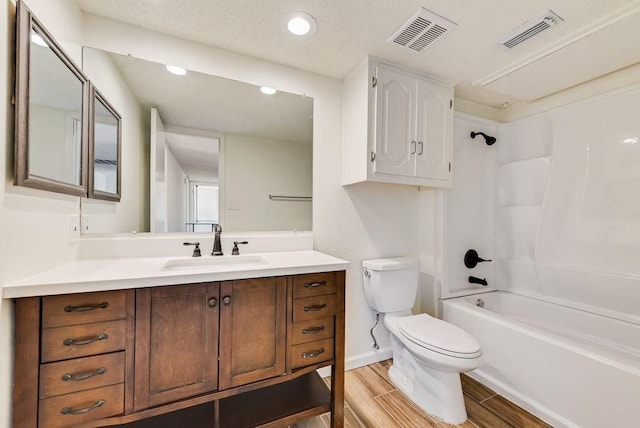 1822 Highbrook Ct, Garland, TX 75044 - full bathroom featuring toilet, vanity,  shower combination, wood finished floors, and recessed lighting
