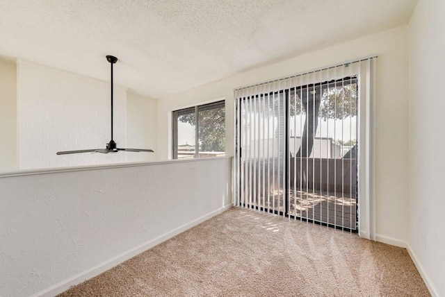 1822 Highbrook Ct, Garland, TX 75044 - carpeted spare room with baseboards, ceiling fan, and a textured ceiling
