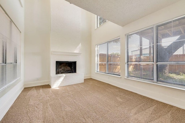 1822 Highbrook Ct, Garland, TX 75044 - unfurnished living room with carpet, a brick fireplace, and baseboards