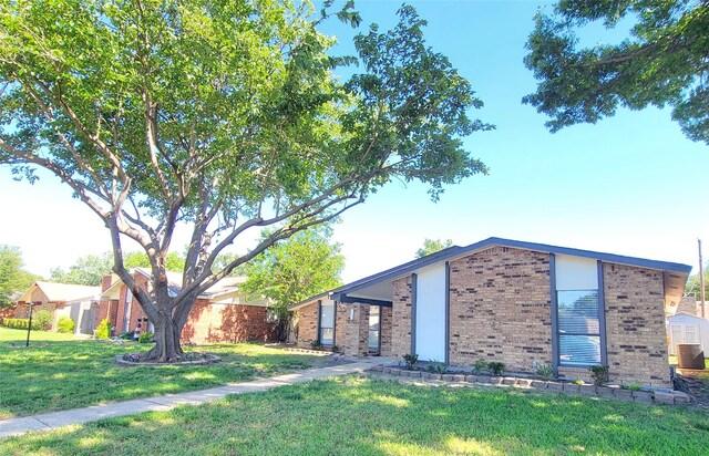 3402 Jones Dr, Rowlett, TX 75088 - mid-century inspired home with brick siding