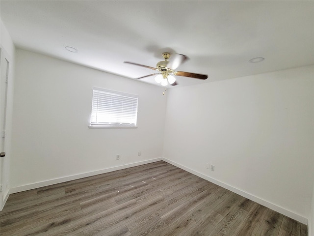 3402 Jones Dr, Rowlett, TX 75088 - unfurnished room featuring a ceiling fan, wood finished floors, and baseboards