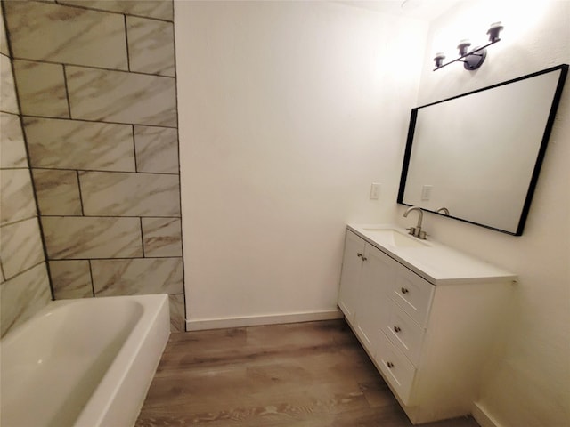 3402 Jones Dr, Rowlett, TX 75088 - bathroom with wood finished floors, vanity, and baseboards