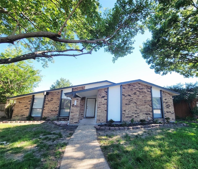 3402 Jones Dr, Rowlett, TX 75088 - mid-century inspired home with brick siding