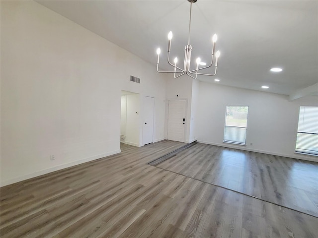 3402 Jones Dr, Rowlett, TX 75088 - unfurnished dining area with a chandelier, wood finished floors, baseboards, and recessed lighting