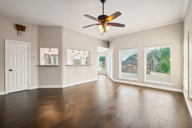 9120 Nob Hill Dr, North Richland Hills, TX 76182 - unfurnished living room with ceiling fan, dark wood-type flooring, baseboards, and crown molding