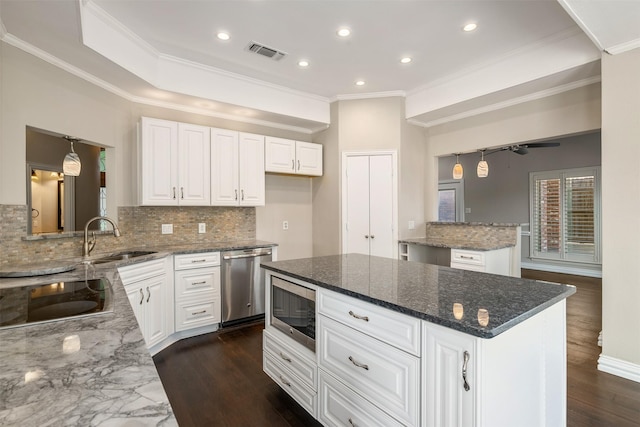 9120 Nob Hill Dr, North Richland Hills, TX 76182 - kitchen with appliances with stainless steel finishes, a sink, tasteful backsplash, dark stone counters, and crown molding