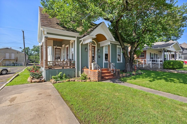 610 W Chestnut St, Denison, TX 75020 - view of front of house featuring covered porch and a front lawn