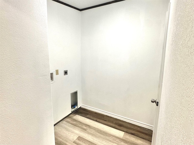 6818 Spring Shower Ct, Krum, TX 76249 - laundry room with hookup for an electric dryer, wood finished floors, ornamental molding, baseboards, and a textured wall