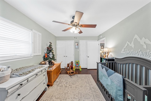 201 Randy Dr, Woodway, TX 76712 - bedroom featuring multiple closets, ceiling fan, and dark wood finished floors
