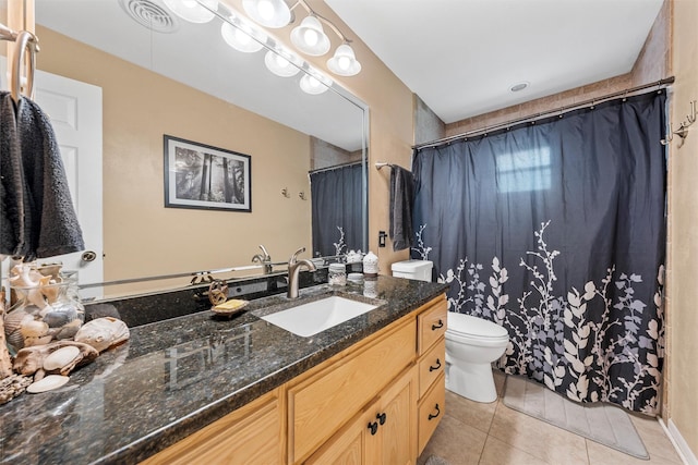 201 Randy Dr, Woodway, TX 76712 - full bath featuring toilet, vanity, tile patterned floors, and curtained shower