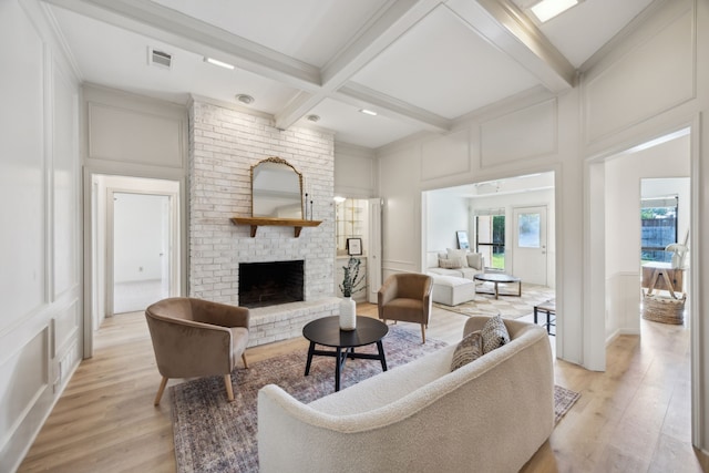 3808 Cromwell, Carrollton, TX 75007 - living room with a decorative wall, beamed ceiling, light wood-style floors, coffered ceiling, and a fireplace