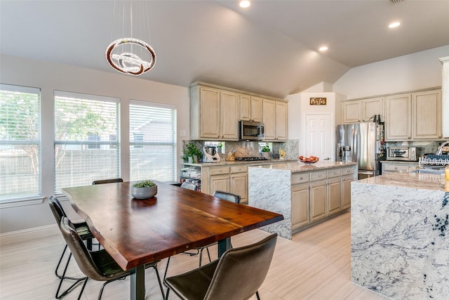 6004 Grand Meadow Ln, Flower Mound, TX 75028 - dining room featuring vaulted ceiling, a chandelier, light wood-type flooring, recessed lighting, and baseboards