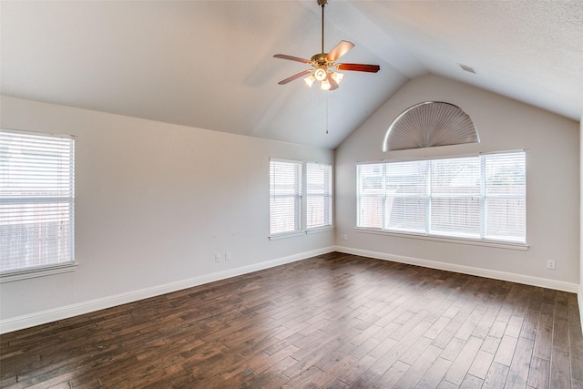 6004 Grand Meadow Ln, Flower Mound, TX 75028 - spare room featuring ceiling fan, dark wood finished floors, vaulted ceiling, and baseboards