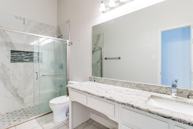 6004 Grand Meadow Ln, Flower Mound, TX 75028 - bathroom featuring vanity, toilet, a marble finish shower, and tile patterned floors
