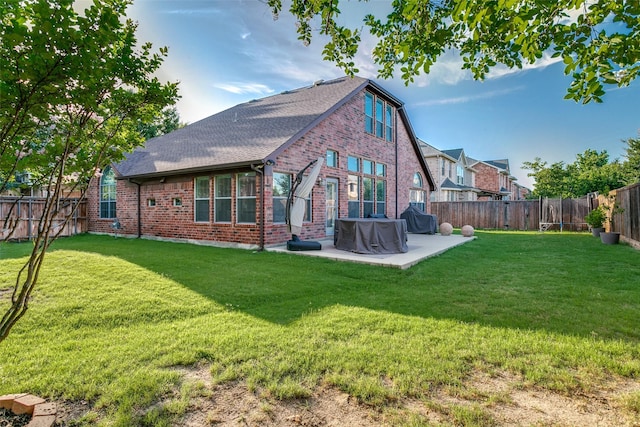 6004 Grand Meadow Ln, Flower Mound, TX 75028 - rear view of house featuring brick siding, a patio area, and a shingled roof