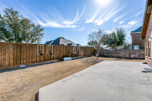 6004 Grand Meadow Ln, Flower Mound, TX 75028 - view of property exterior with a fenced backyard and a patio