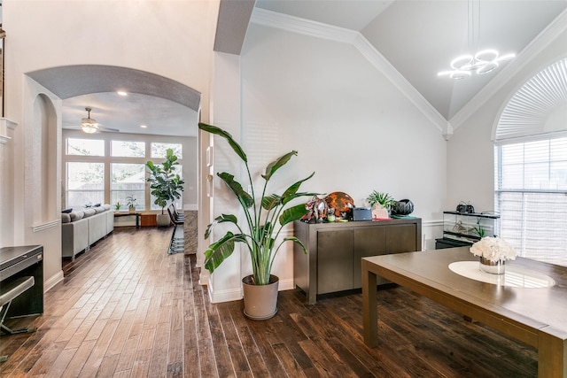 6004 Grand Meadow Ln, Flower Mound, TX 75028 - dining space featuring arched walkways, dark wood-style floors, baseboards, ceiling fan, and vaulted ceiling
