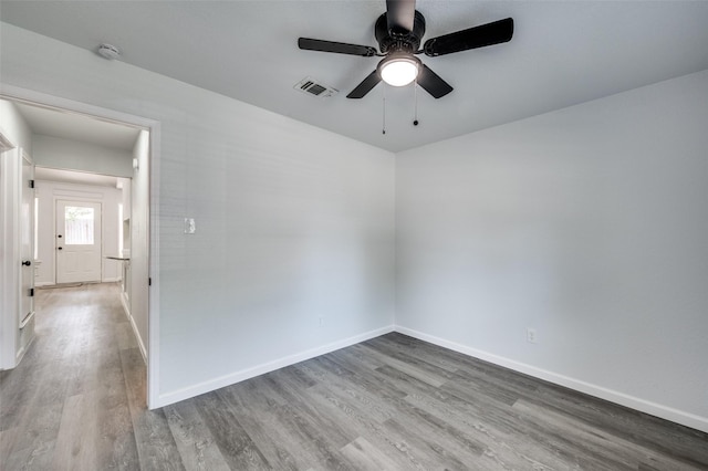 7708 Partridge Dr, Watauga, TX 76148 - spare room with wood finished floors, baseboards, ceiling fan, and a smoke detector
