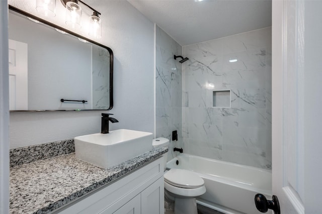 7708 Partridge Dr, Watauga, TX 76148 - bathroom featuring vanity, washtub / shower combination, and toilet