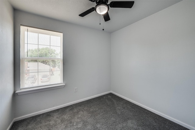 7708 Partridge Dr, Watauga, TX 76148 - unfurnished room featuring baseboards, dark carpet, and a ceiling fan