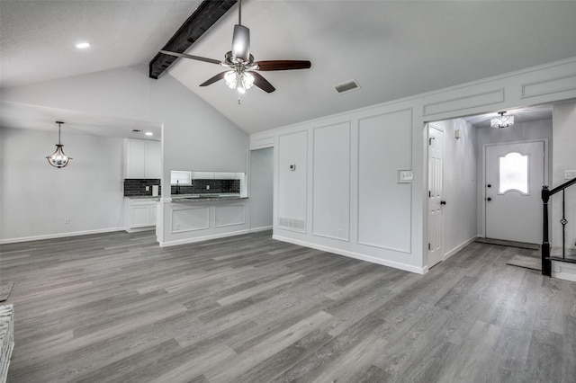 7708 Partridge Dr, Watauga, TX 76148 - unfurnished living room with a ceiling fan, wood finished floors, stairway, and baseboards