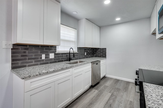 7708 Partridge Dr, Watauga, TX 76148 - kitchen featuring dishwasher, a sink, backsplash, white cabinets, and recessed lighting