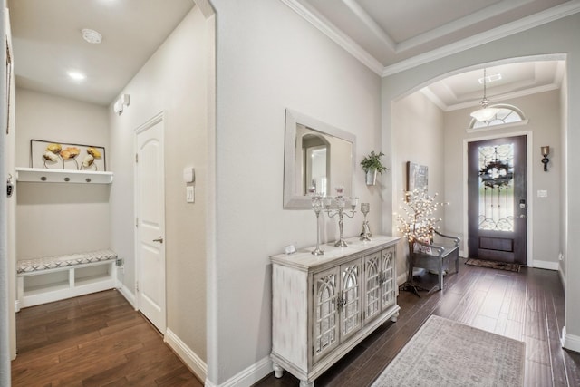 16001 Gladewater Ter, Prosper, TX 75078 - entrance foyer featuring arched walkways, dark wood-type flooring, ornamental molding, baseboards, and a tray ceiling