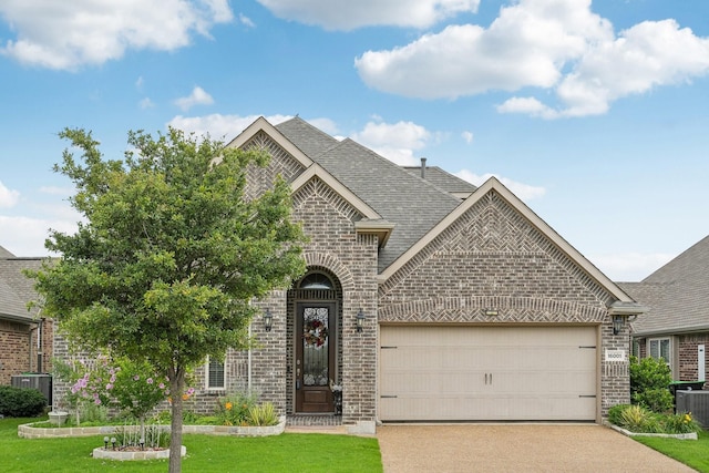 16001 Gladewater Ter, Prosper, TX 75078 - french country style house featuring brick siding, an attached garage, driveway, and a front yard