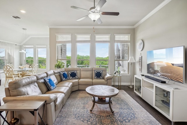16001 Gladewater Ter, Prosper, TX 75078 - living room featuring crown molding, baseboards, ceiling fan, dark wood-style flooring, and vaulted ceiling