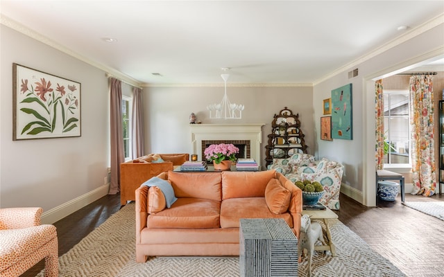 4407 Ridge Rd, Dallas, TX 75229 - living room with baseboards, crown molding, a fireplace, wood finished floors, and a chandelier