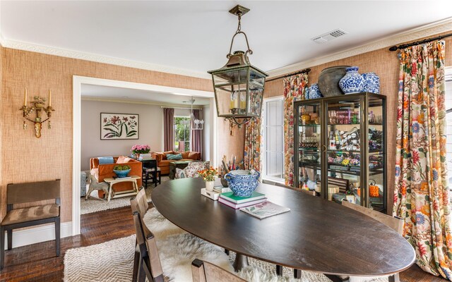 4407 Ridge Rd, Dallas, TX 75229 - dining area featuring ornamental molding, baseboards, wallpapered walls, and wood finished floors