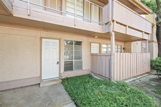 10578 High Hollows Dr Unit 166, Dallas, TX 75230 - view of exterior entry featuring a balcony and stucco siding