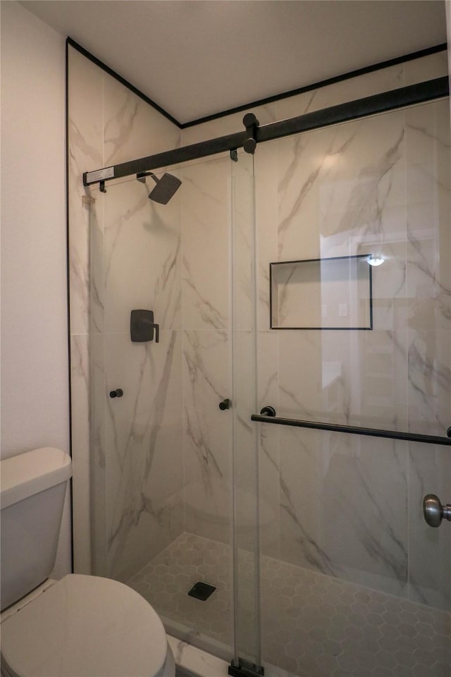 10578 High Hollows Dr Unit 166, Dallas, TX 75230 - full bathroom featuring toilet and a marble finish shower