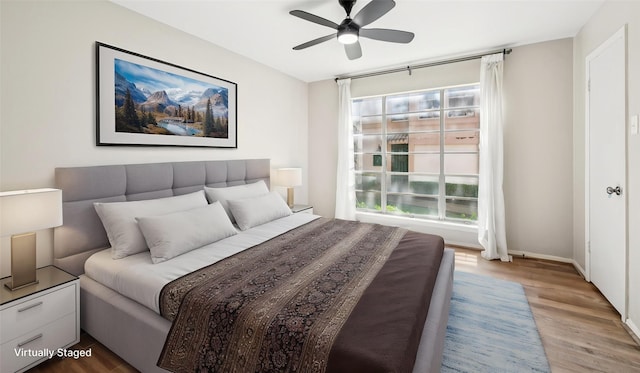 10578 High Hollows Dr Unit 166, Dallas, TX 75230 - bedroom featuring multiple windows, wood finished floors, and ceiling fan