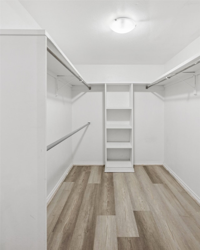 10578 High Hollows Dr Unit 166, Dallas, TX 75230 - spacious closet featuring wood finished floors