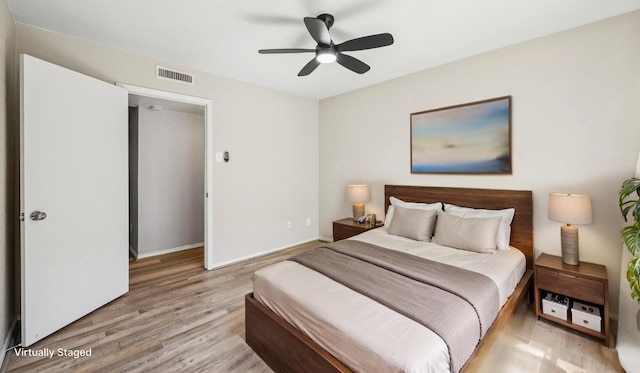 10578 High Hollows Dr Unit 166, Dallas, TX 75230 - bedroom featuring light wood-type flooring, baseboards, and a ceiling fan