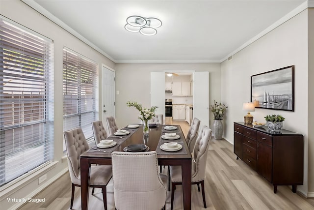 10578 High Hollows Dr Unit 166, Dallas, TX 75230 - dining space with plenty of natural light, light wood-style flooring, ornamental molding, and baseboards