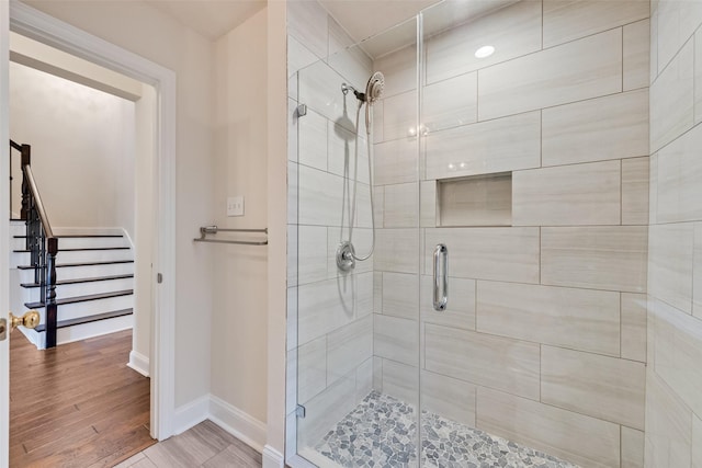 9122 Bottlebrush Ln, Irving, TX 75063 - full bathroom featuring a shower stall, baseboards, and wood finished floors