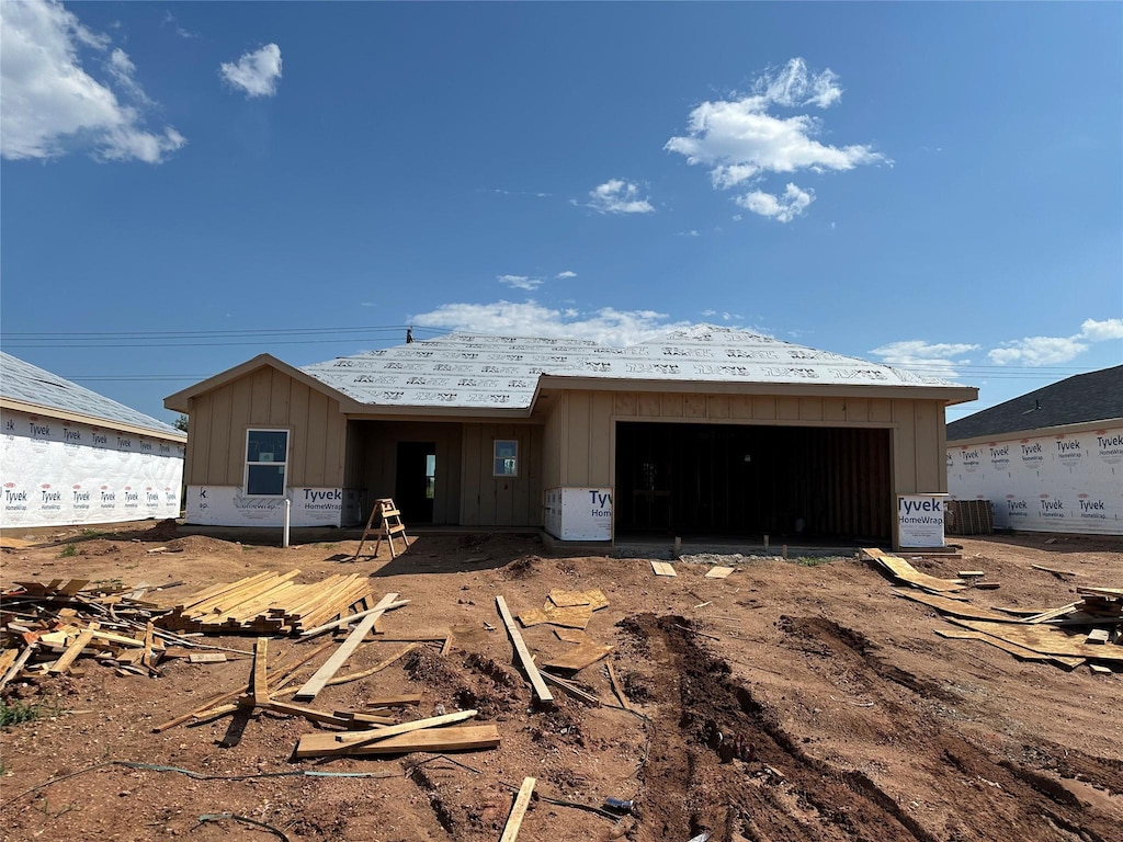 7093 Tin Cup, Abilene, TX 79606 - property under construction with board and batten siding and an attached garage